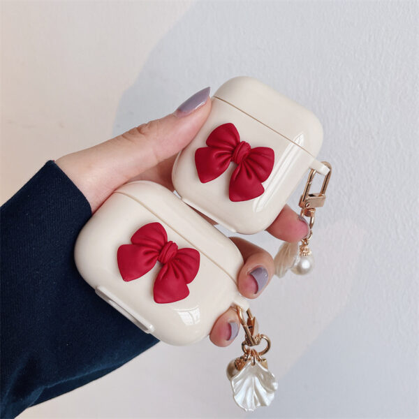 362eb976-e479-4023-9fb4-b5d2100cd259.jpg Beige Red Bow Shell Pendant Wireless Earphone Case